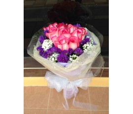 F19 12 PCS DEEP PINK ROSES WITH WHITE WRAPPING IN ROUND